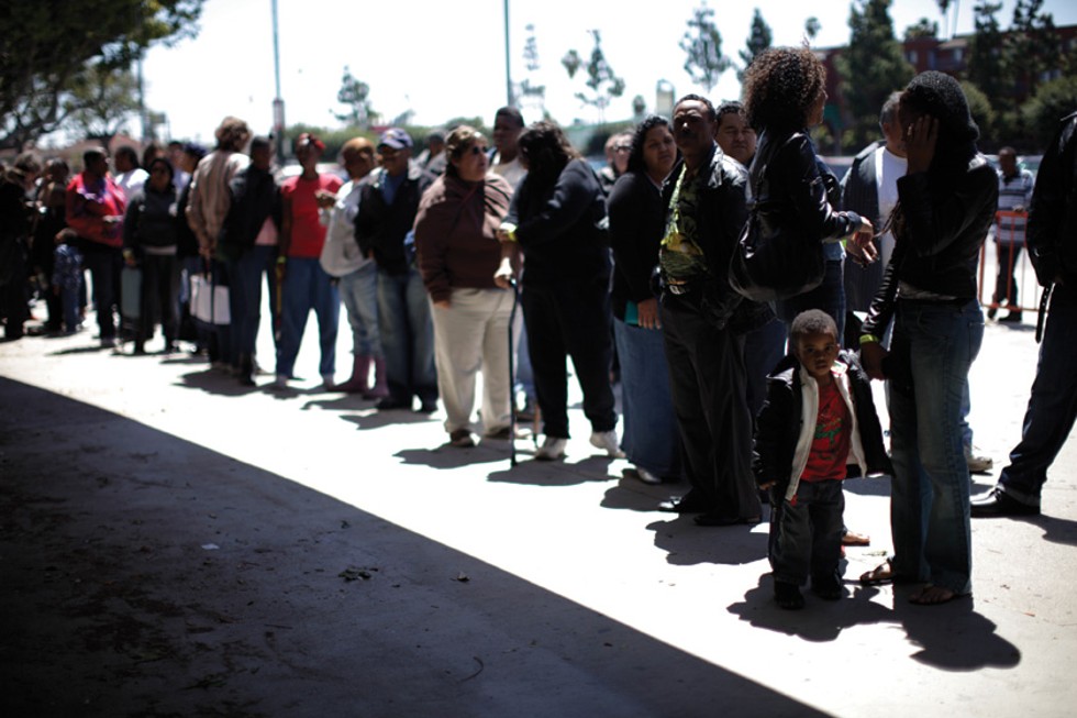 Patients wait for their wristband number to be called at the Remote Area Medical clinic in Los Angeles on April 28, 2010. Over seven days, doctors and dentists volunteering their services brought free medical, dental, and vision care to 7,000 uninsured and underinsured people in Los Angeles.