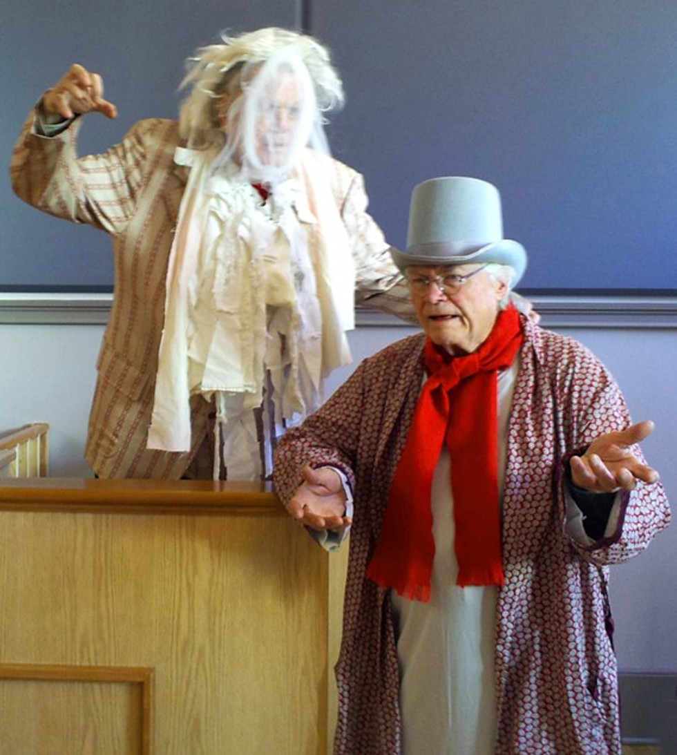 Scrooge (l) interrogates Marley's ghost on the stand