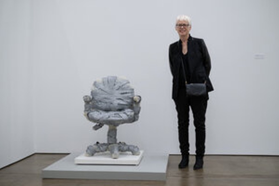 Artist Jeanne Silverthorne next to her "Bubble Wrapped Task Chair with Rubber Base"