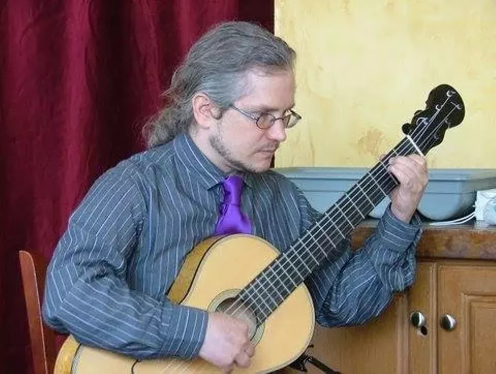 007c07aa_eric_on_guitar_2.2.15.webp