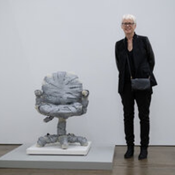 Artist Jeanne Silverthorne next to her "Bubble Wrapped Task Chair with Rubber Base"