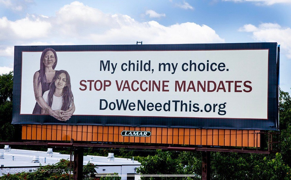 A billboard reading "My child, my choice. Stop vaccine mandates."