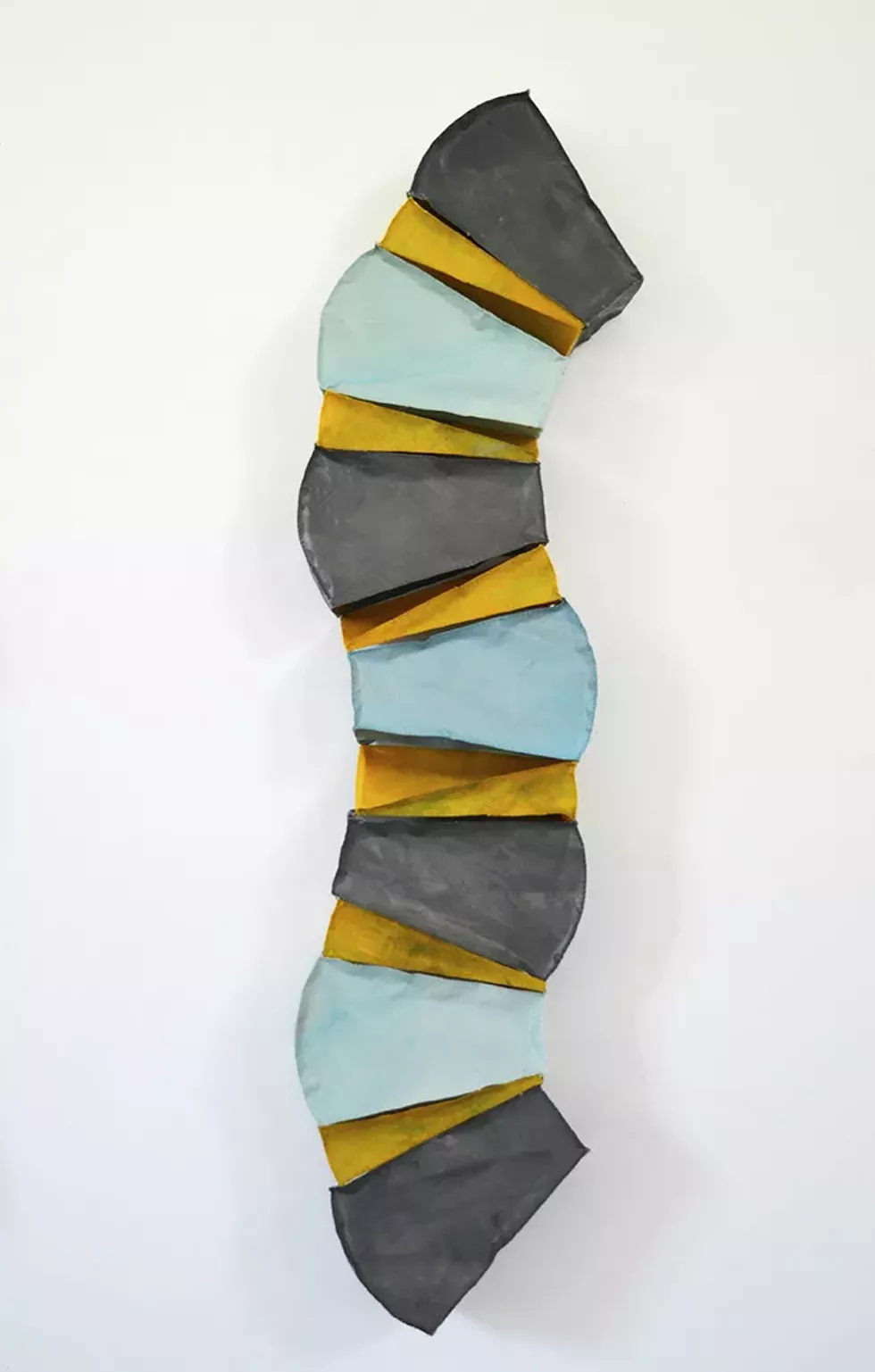 Pillar, 2022, hand-stitched paper and wax, 46 x 12 x 6 inches