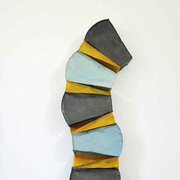 Pillar, 2022, hand-stitched paper and wax, 46 x 12 x 6 inches