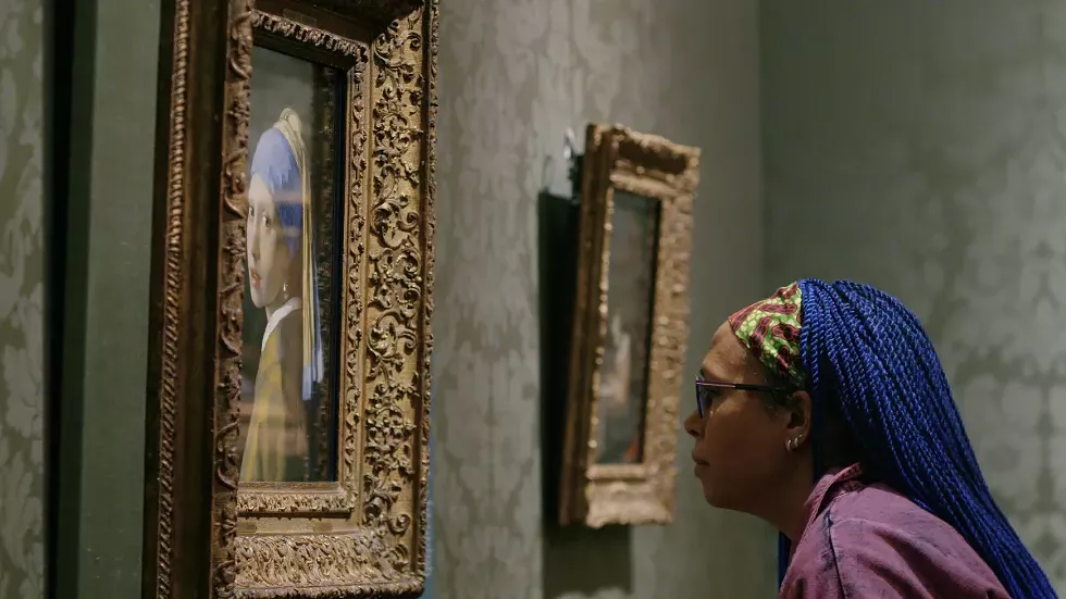Abbie Vandivere, a paintings conservator at the Mauritshuis in The Hague, the Netherlands, examines Vermeer's most famous painting.