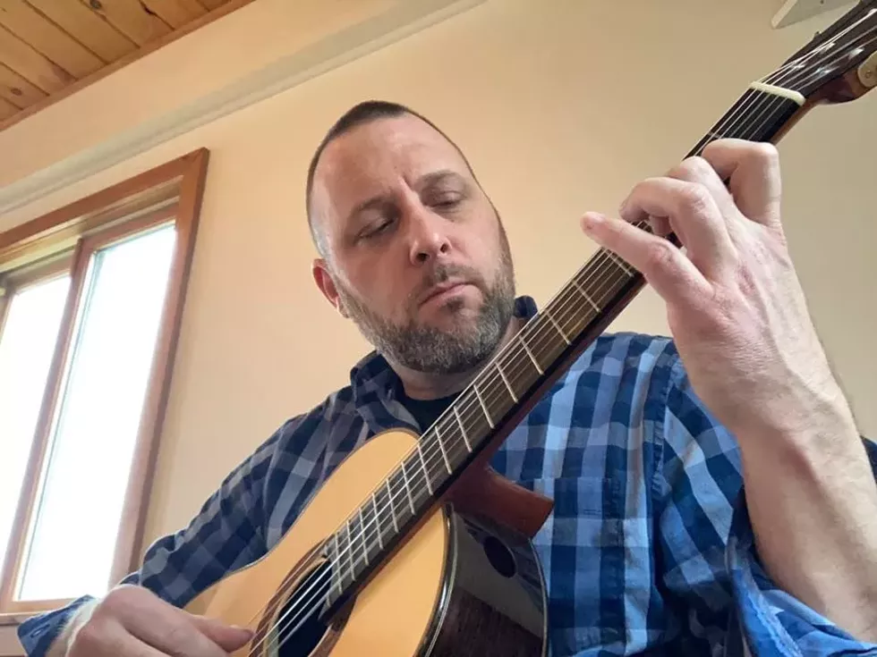 dan-stevens-closeup-strumming.webp