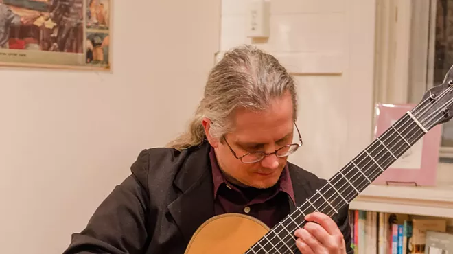 Image: Eric J Roth on classical guitar