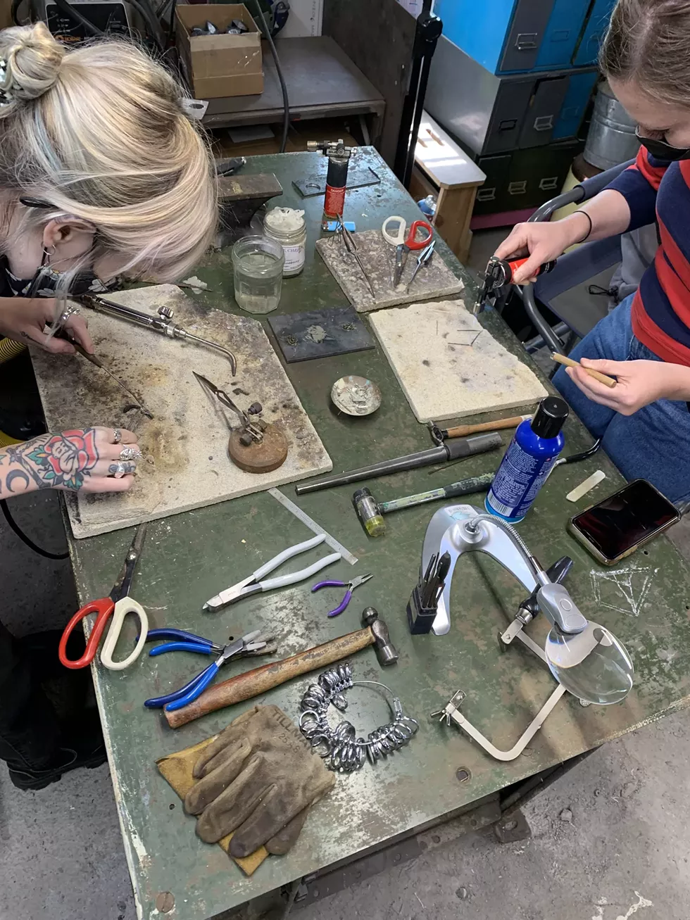students working on their own silver rings in class!