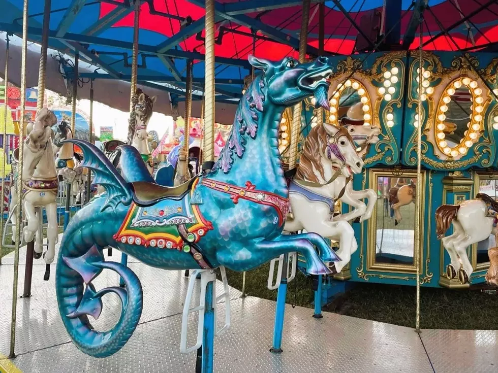 The carnival features midway rides for all ages.