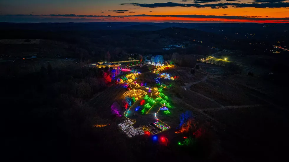 Lumina transforms Harvest Moon Farm & Orchard into a glowing winter wonderland, with vibrant light displays set against a beautiful twilight sky.