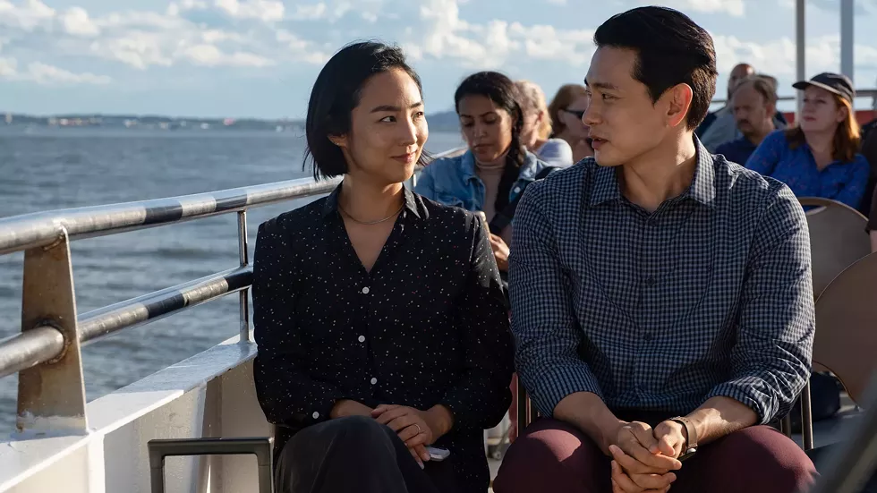 Greta Lee and Teo Yoo star.