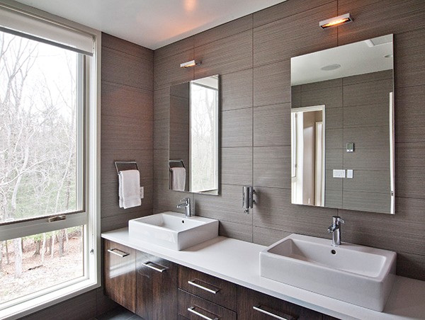 The master bath’s simplicity is accented by the ceramic tile walls.