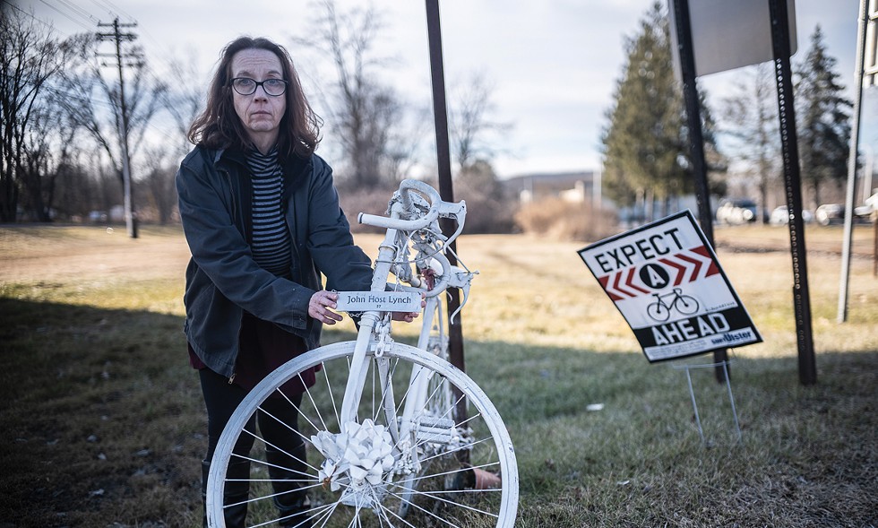 Bicycle advocate Rose Quinn at the spot where her partner, John "Host" Lynch, was struck and killed by a car on July 20, 2021.