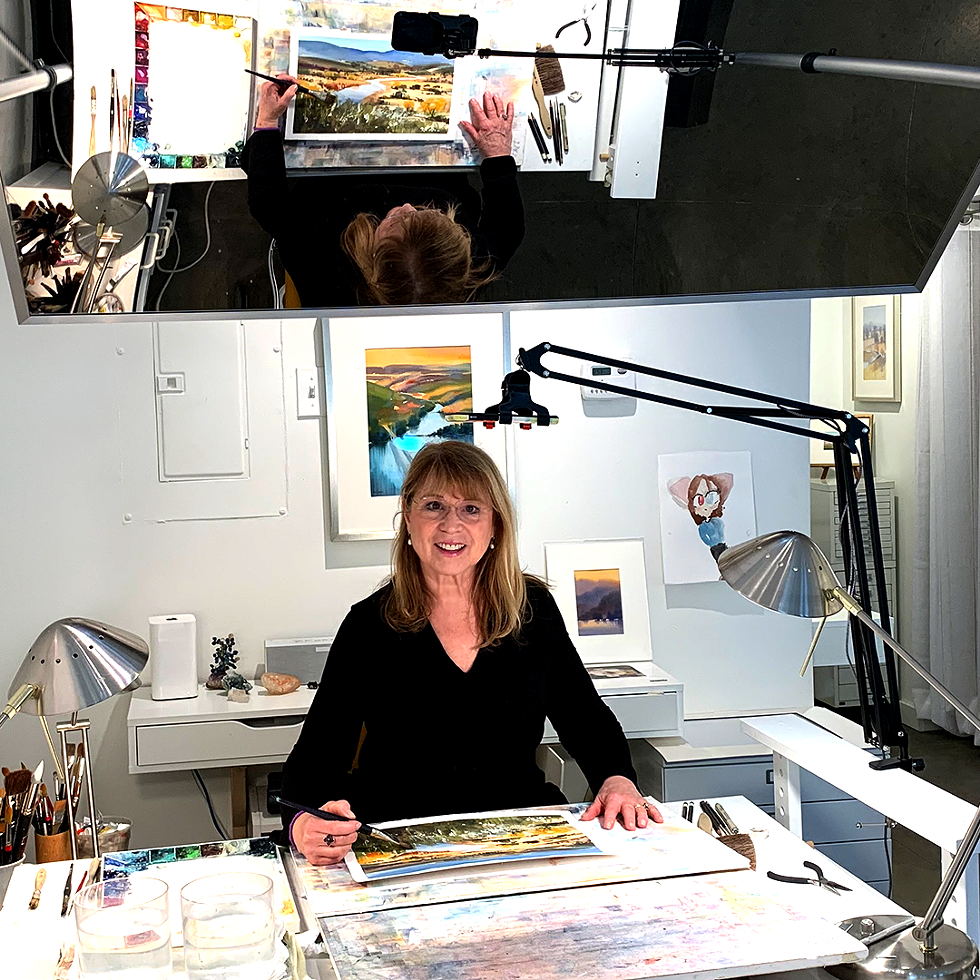 Betsy Jacaruso live streaming from her desk.