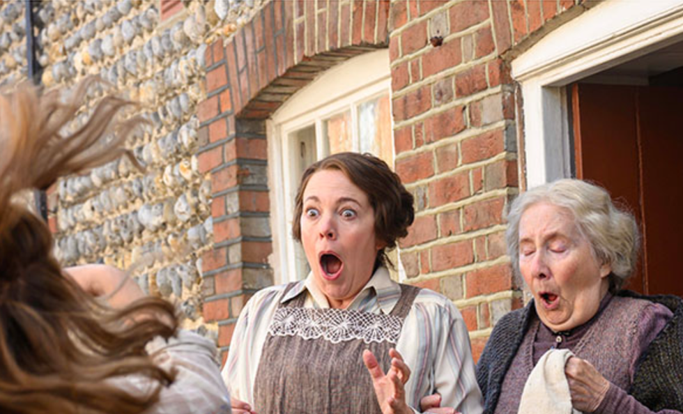 Olivia Colman (center) stars.